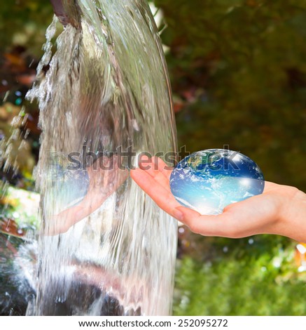 Water drop shape in the hand ( drinking water crisis) 