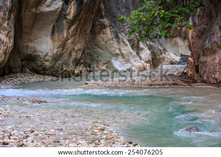 Mountain stream full of smooth rocks in Saklikent Gorge Canyon in Turkey