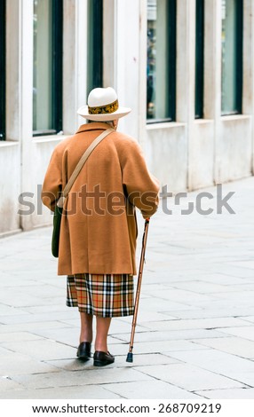 Old Woman Walking with Cane in Venice italy