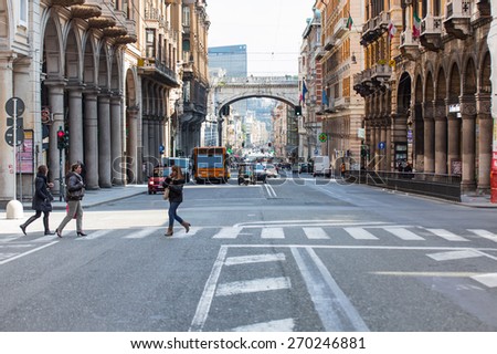 GENOA, ITALY - MARCH 18, 2015:The street with ancient buildings in the center of Genoa, Italy