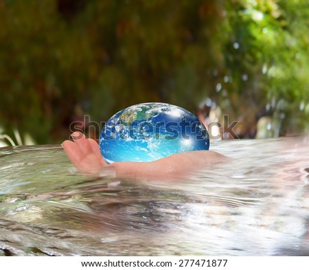 Water drop shape in the hand ( drinking water crisis) \
