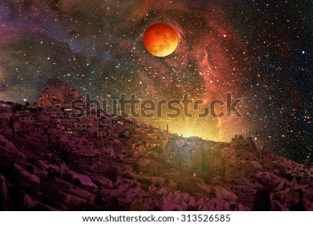 Lunar eclipse and Super Moon against Cappadocia at night \