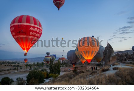 GOREME,TURKEY - OCTOBER 19, 2015: Hot air balloons fly over Cappadocia is known around the world as one of the best places to fly with hot air balloons,