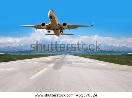 passenger plane fly up over take-off runway from airport