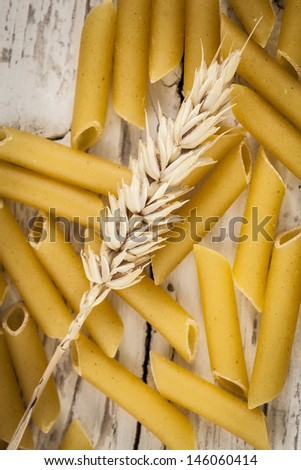 Raw pasta with wheat ears