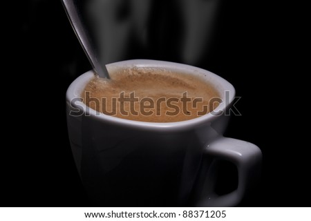 Coffee cup on black background