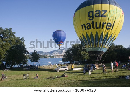 GENEVA  AUGUST 6: Balloons taking off at the Geneva Balloon Festival August 6, 2010 in Geneva, Switzerland