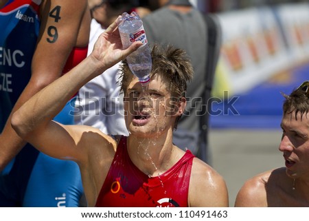 GENEVA - JULY 22: Unidentified athlete cooling off after competing in the running section of the 2012 ITU Triathlon European Cup, July 22, 2012 in Geneva, Switzerland