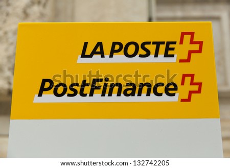 GENEVA - MARCH 24: A sign for PostFinance on March 24, 2013 in Geneva, Switzerland. The future PostFinance Ltd has been rated AA by Standard & PoorÃ¢Â?Â?s and will be granted a banking license.
