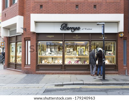 LONDON, ENGLAND -Â?Â? DECEMBER 14, 2013: A Berrys jeweller retail outlet. Berrys have stores nationwide in the UK with brands such as Breitling, Chanel, Patek Philippe, Chopard, Bulgari and Omega.