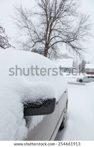 OTTAWA, CANADA  FEBRUARY 21, 2015:  A car is covered in heavy snow. Reports indicate that Ottawa has had the most days with temperatures below -15 C in 2015 since 1888.