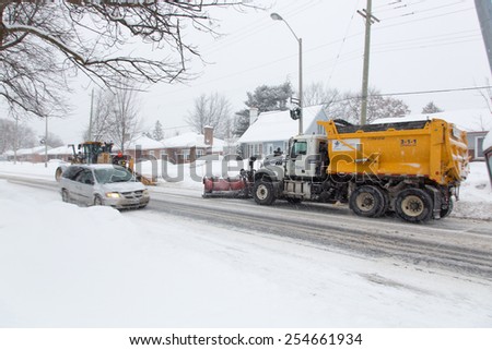 OTTAWA, CANADA Ã¢Â?Â? FEBRUARY 21, 2015:  A snow plough works clearing heavy snow. Reports indicate that Ottawa has had the most days with temperatures below -15 C in 2015 since 1888.