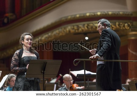 GENEVA, SWITZERLAND  MARCH 1, 2015: Soprano Eva Fiechter singing with the United Nations Orchestra at a concert at the Victoria Hall commemorating 200 years of Geneva in the Swiss Confederation.