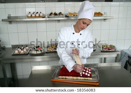 Young girl baking cakes