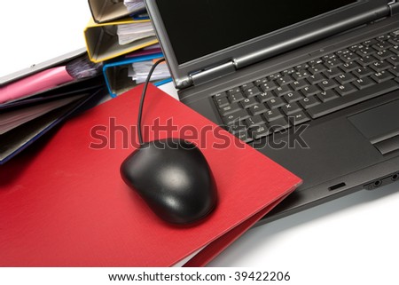 Isolated stack of folders with laptop computer shot over white background