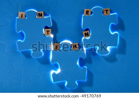 Blue puzzle with wood letter
