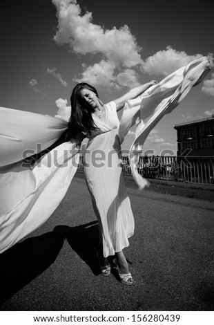 Black and white shot of sexy girl with long white veil