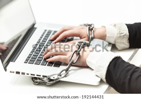 Photo of female locked to laptop by chain