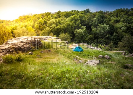 Beautiful landscape of tents on top of mountain at sunset