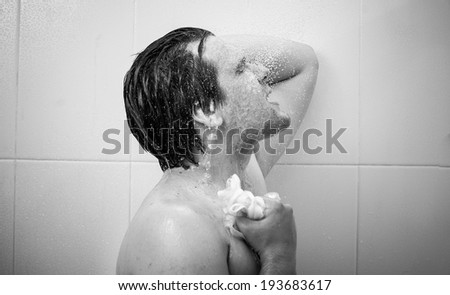 Black and white closeup portrait of smiling man at douche