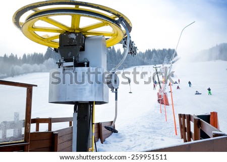 Ski chair lifts on foot of ski slope at Austrian Alps