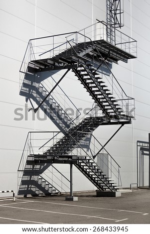 Metal staircase on fire exit at big factory
