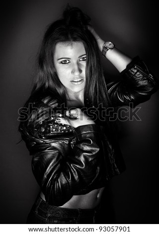 black and white fashion photo of sexy girl in leather coat