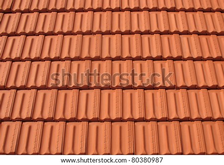 A horizontal background of red roof tiles.