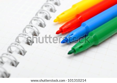 Notebook and felt-tip pens.