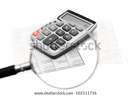Documents and the calculator through a magnifier.