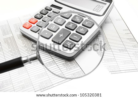 The calculator, documents and magnifier.
