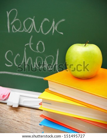 Apple on books. Against a school board. Back to school.