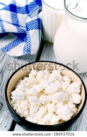 Dairy products on a wooden background.