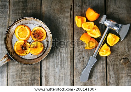 Fried oranges and hammer with the wrung out slices of oranges.