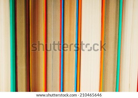 Multi-coloured books. A background from multi-coloured books.