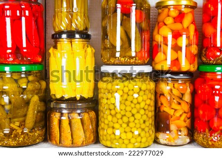 Preserved food in glass jars. Various marinaded food