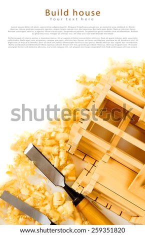 Woodworking. House construction. Joiner\'s works. The wooden house, chisel, plane and shaving on white background.