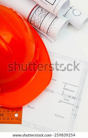 Planning of construction of the house. Drawings for building house, helmet and other working tools.