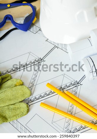 Planning of repair of the house. Repair work. Drawings for building, helmet, mount and others tools on wooden background.
