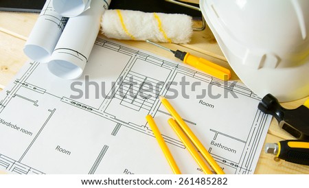 Planning of repair of the house. Repair work. Drawings for building, saw, hammer and others tools on wooden background.