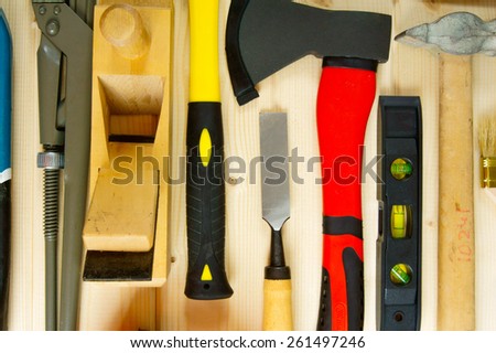 Working tools. Many working tools on a wooden background.