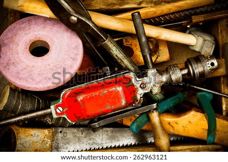 Old working tools. Vintage working tools on wooden background.