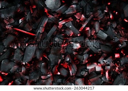 Burning coals. Decaying charcoal. Backround with charcoal.
