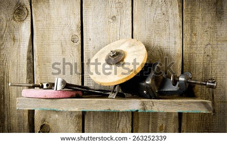 Old working tools. Many old tools ( pliers, circle and others) on a wooden shelf.