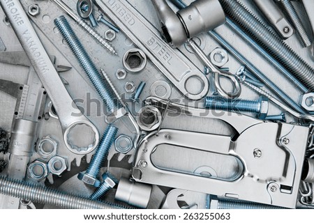 Metal tools. Metal style. Many metal tools on the scratched metal background.