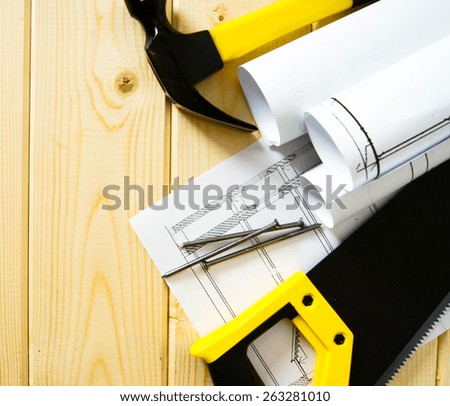 Planning of repair of the house. Repair work. Drawings for building and working tools on wooden background.