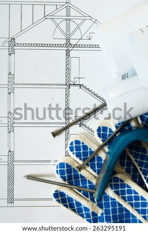 Planning of repair of the house. Repair work. Drawings for building, mount and gloves on wooden background.
