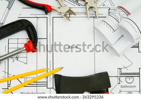 Planning of construction of the house. Drawings for building house and working tools.