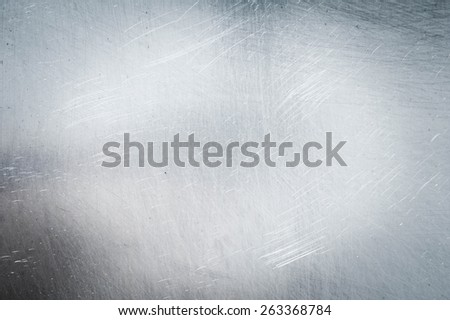 Metal background. Grange a background. Metal sheet in scratches.