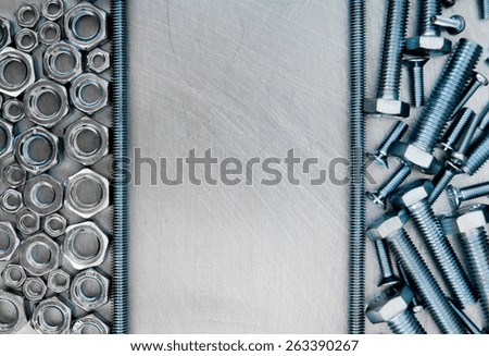 Metal working tools. Frame metal style. Hairpin and other fixing elements on the scratched metal background.